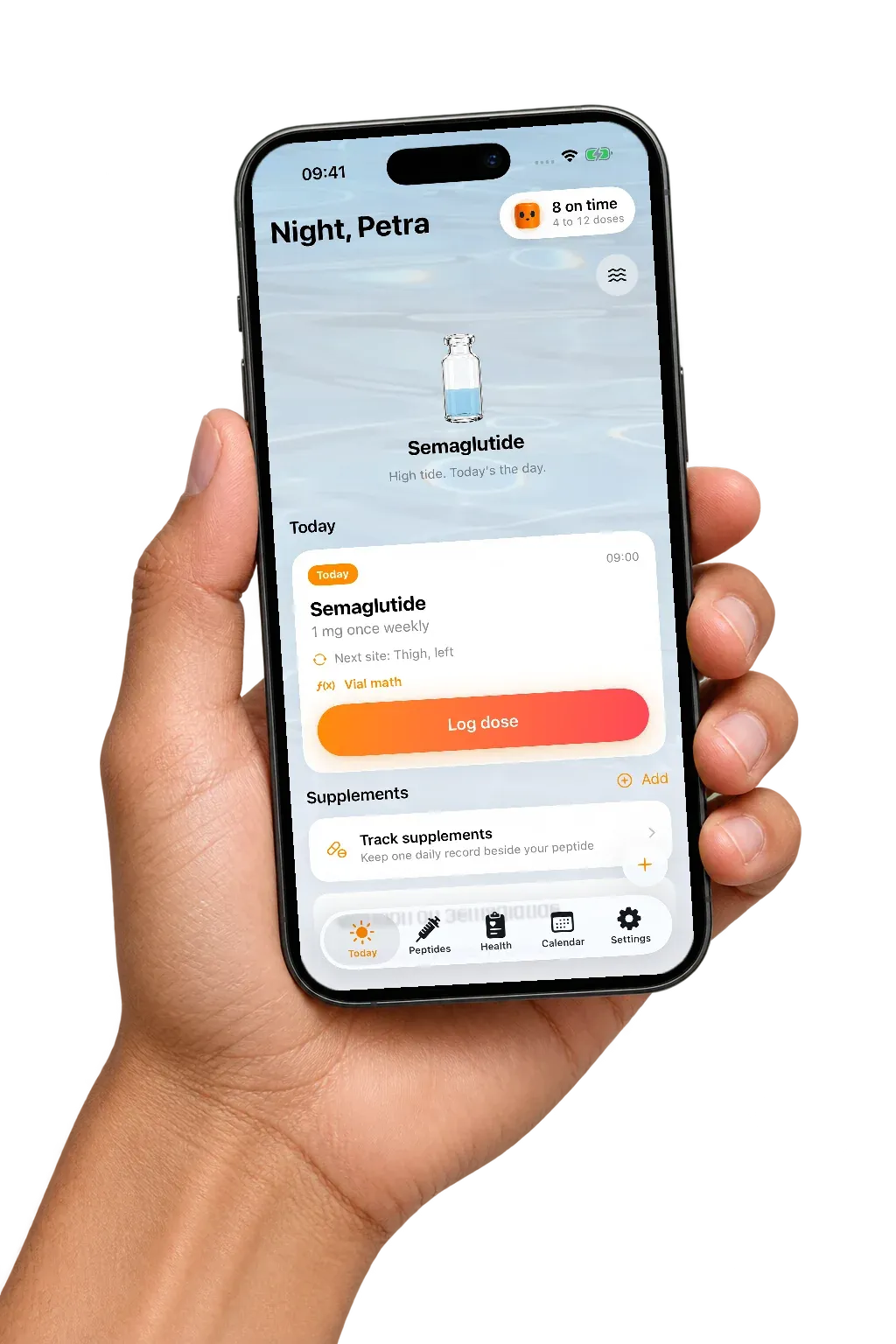 A hand holding an iPhone open on Tiding’s Today screen, with the next Semaglutide dose and a Log dose button